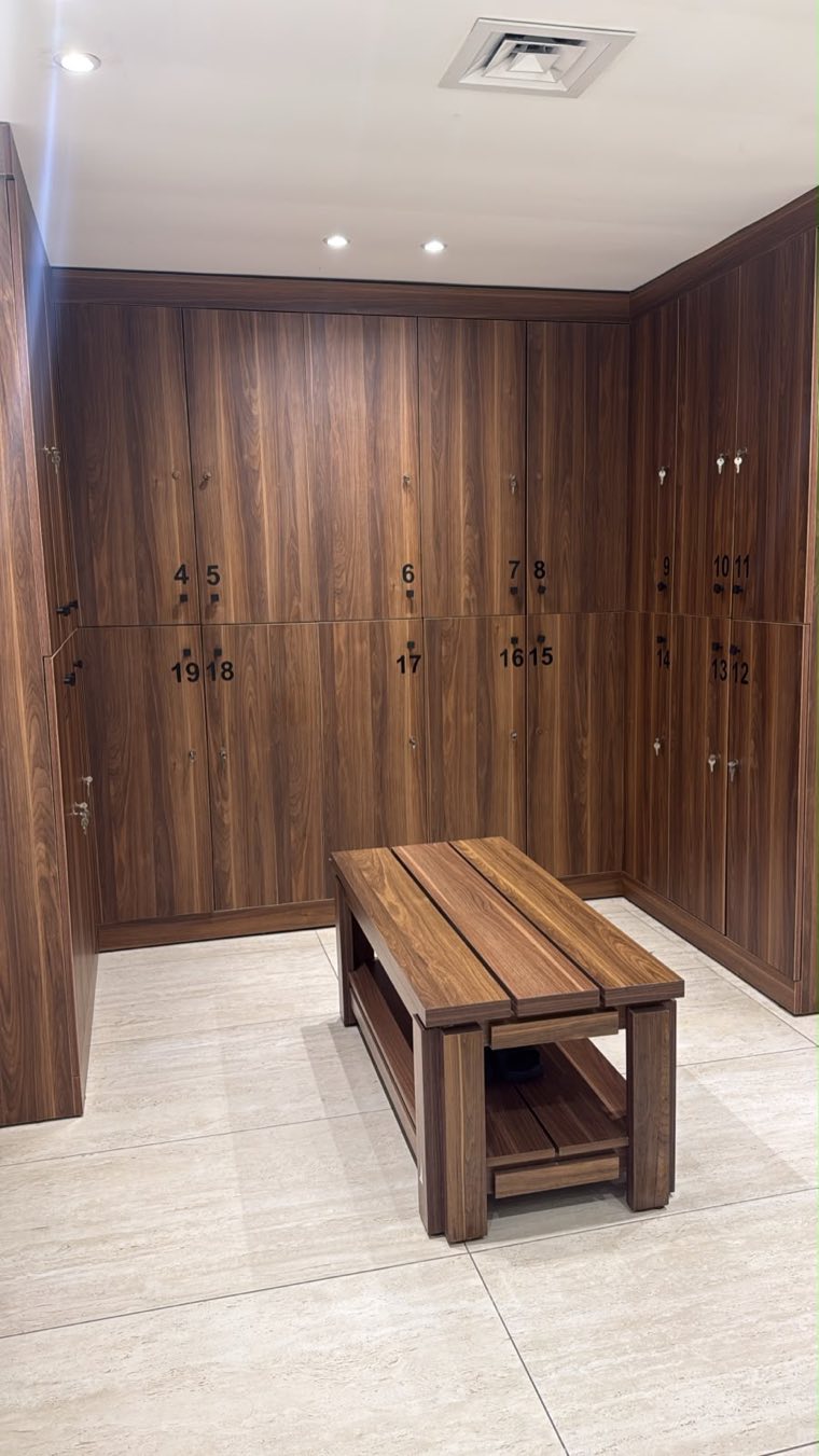 Wooden lockers and bench in the locker room